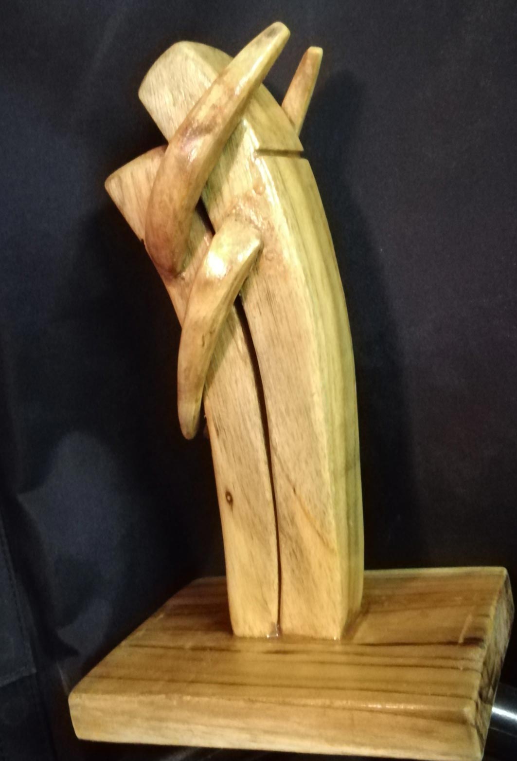 Figurative Sculpture with Wood"Passionate Hug" art by Abhijit Dutta