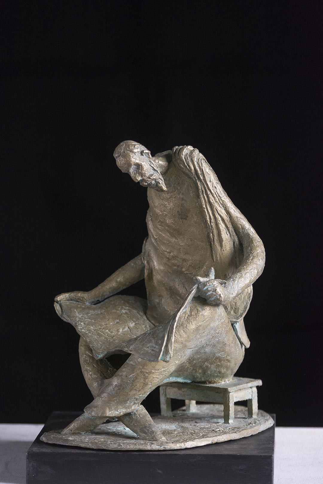 Figurative Sculpture with Bronze"Reader" art by Prabir Roy